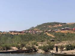 Resettlement housing along Nam Tha River. By SUN Jingyu Cecilia, 2018.
