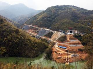 Tunnel portal under construction for China-Laos Railway. By Ashley Scott Kelly, 2018.