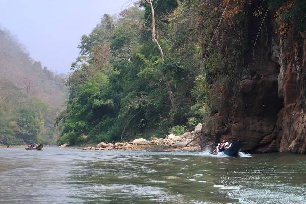 HKU landscape students on longboats within planned reservoir area on tributary of the Salween (Thanlwin/Nujiang) River, Thailand. By Ashley Scott Kelly, 2023.